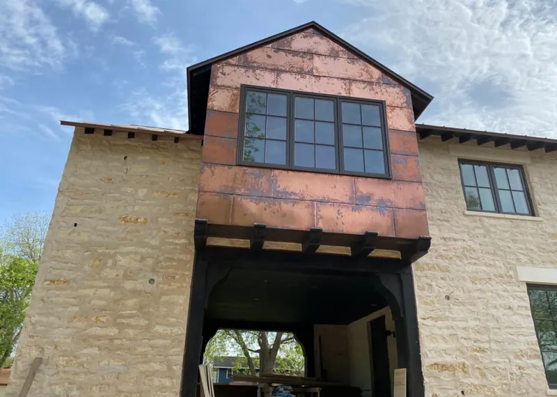 Copper metal panel facade on a stone building for Skylight Installation in Richton Park